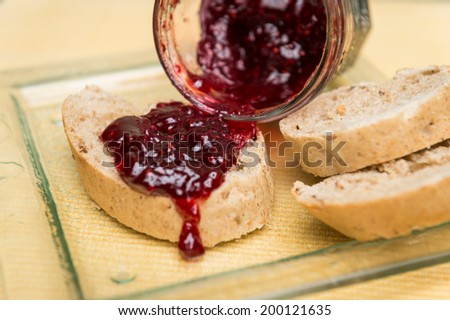 Delicious toast with jam on table close-up