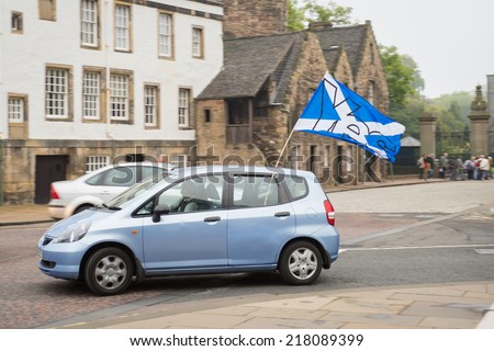 EDINBURGH, SCOTLAND, UK - September 18, 2014 - public expressing their opinion on independence during referendum day using YES flags