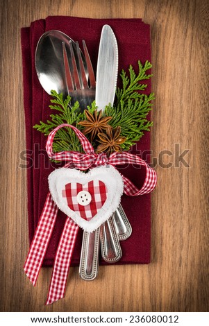 Christmas table setting, christmas menu concept in red, green and white color tone on wooden table with copy text space