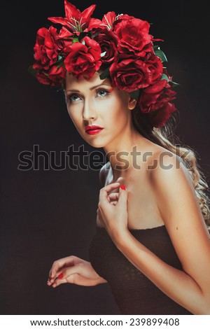 Girl in black and flowers on her head. Beauty women.Jewelry and beauty. perfect skin, blond hair. Girl with a stylish haircut. Skin care.