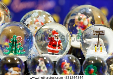 Santa claus in a crystal water ball or Christmas water globe for Christmas  decoration (A selective focus picture)