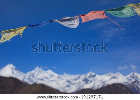 Himalayan view with colorful prayer flags and clear blue sky in Muktinath, Upper Mustang, Nepal