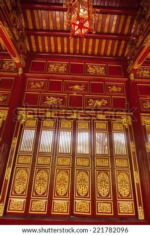 The Citadel, Hue, Vietnam. Unesco World Heritage Site. Forbidden City. Red wooden hall in Citadel in Vietnam, Asia. Beautiful design inside Hue Imperial City. Traditional asian interior of building.