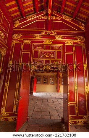 The Citadel, Hue, Vietnam. Unesco World Heritage Site. Forbidden City. Red wooden hall in Citadel in Vietnam, Asia. Beautiful design inside Hue Imperial City. Traditional asian interior of building.