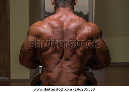 body builder flexing his back