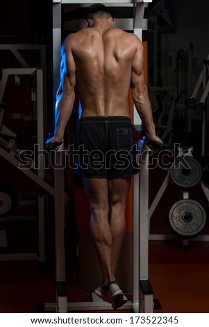 Young Man Doing Exercise For Triceps - Young Male Bodybuilder Doing Heavy Weight Exercise For Triceps
