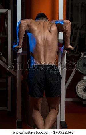 Young Man Working Out Triceps - Bodybuilder Doing Heavy Weight Exercise For Triceps