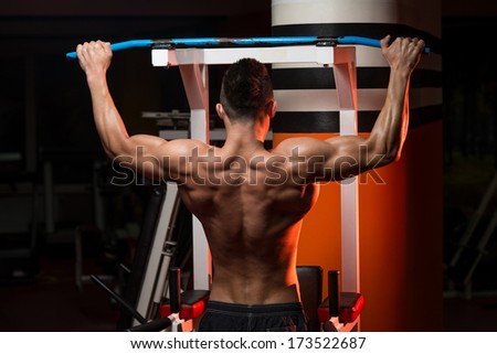Young Man Doing Exercise For Back - Bodybuilder Doing Heavy Weight Exercise For Back