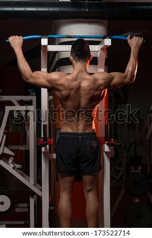Young Man Doing Exercise For Back - Bodybuilder Doing Heavy Weight Exercise For Back