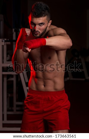 Young Fighter Is Giving A Finishing Punch - Muscular Boxer MMA Fighter Practice His Skills