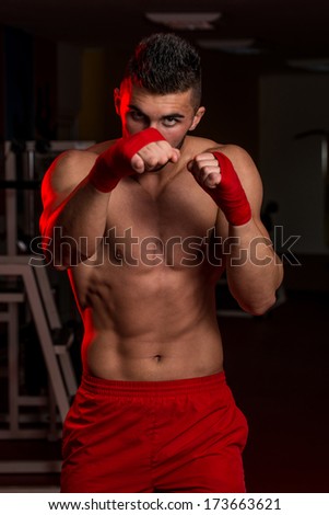 Warrior - Muscular Boxer MMA Fighter Practice His Skills