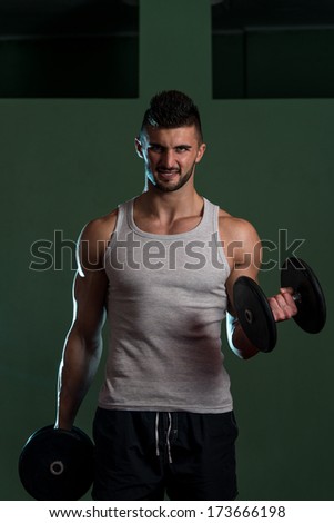 Muscular Man Exercising Biceps