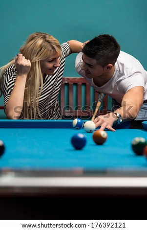 Boy And Girl Flirting On A Pool Game - Young Caucasian Man Receiving Advice On Shooting Pool Ball While Playing Billiards