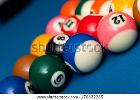 Billiard Balls Ready For The Break - Close-Up Of Pool Balls On A Blue Pool Table