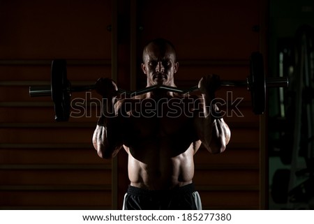 Be Strong - Muscular Man Doing Heavy Weight Exercise For Biceps