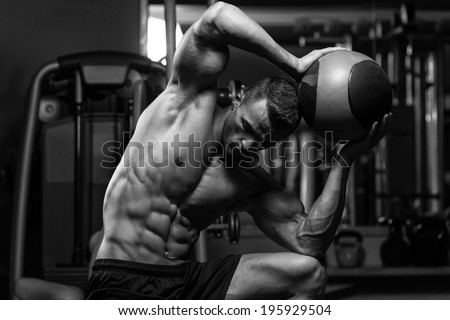 Muscular Man Exercise With Medical Ball