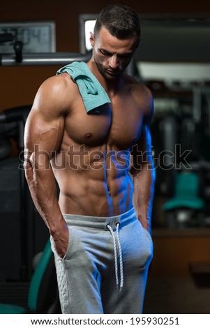 Portrait Of A Physically Fit Young Man In A Healthy Club - No Pain No Gain