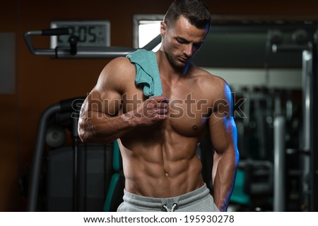 Portrait Of A Physically Fit Young Man In A Healthy Club - Bodybuilding Is Exercise And Nutrition At Its Best