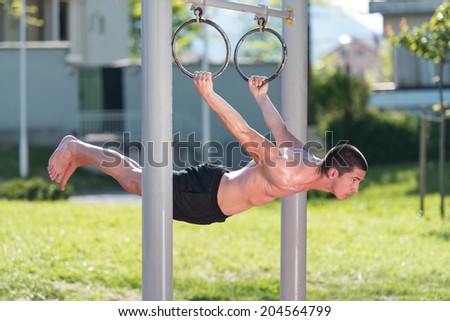 Street Workout - Handsome Muscular Man Workout In The Park