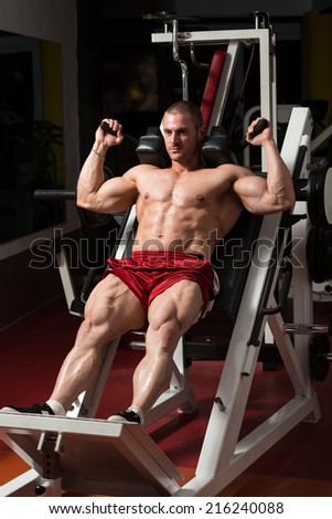 Male Bodybuilder Doing Heavy Weight Exercise For Legs