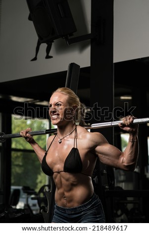 Woman Doing Squat Exercise For Legs - Female Bodybuilder Doing Heavy Weight Exercise For Legs Barbell Squat