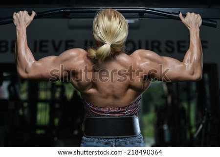 Female Bodybuilder Doing Heavy Weight Exercise For Back In Gym