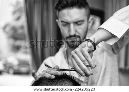 Hands Of Professional Hair Stylist - Handsome Young Hairdresser Giving A New Haircut To Male Customer At Parlor