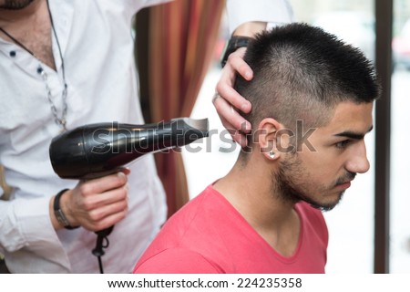 Stylist Drying Hair Of A Male Client - Handsome Man At The Hairdresser Blow Drying His Hair
