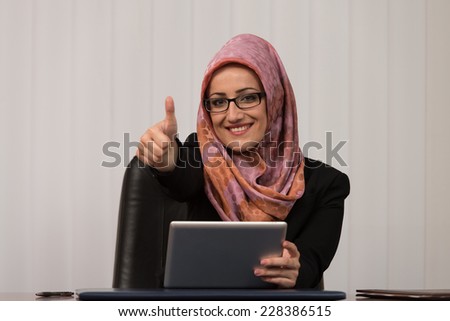 Happy Muslim Business Woman With Thumbs Up Gesture