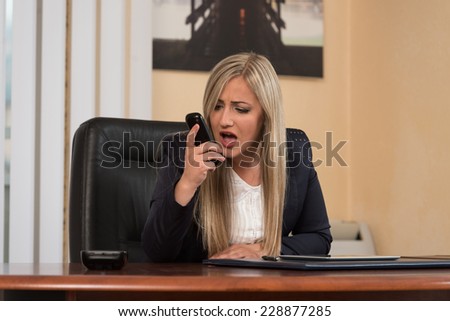 Young Business Woman With Problems And Stress In The Office