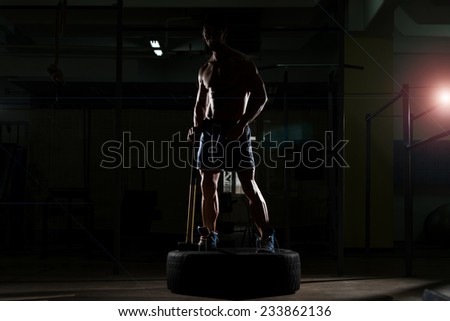 Athletic Man Hits Tire - Workout At Gym With Hammer And Tractor Tire Siluet