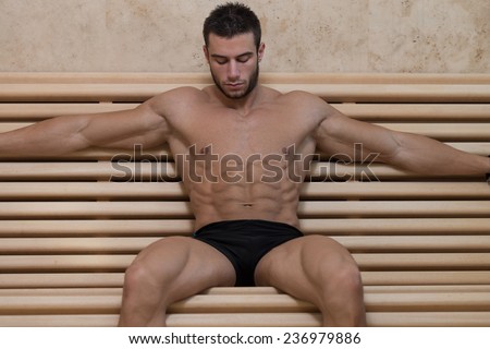 Good Looking And Attractive Young Man With Muscular Body Relaxing In Sauna Hot