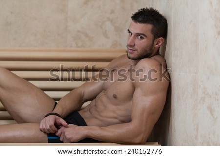 Happy Good Looking And Attractive Young Man With Muscular Body Relaxing In Sauna Hot