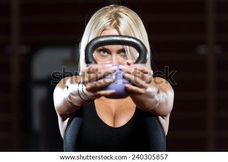 Fitness Woman Working Out With Kettle Bell