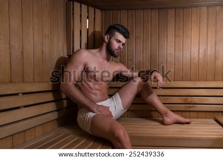 Happy Good Looking And Attractive Young Man With Muscular Body Relaxing In Sauna Hot