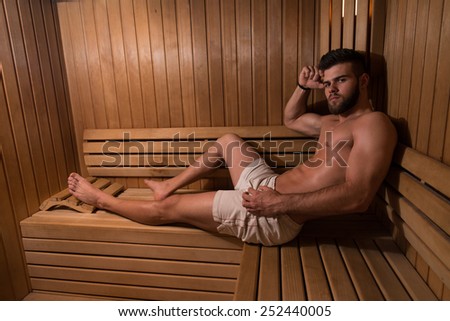 Happy Good Looking And Attractive Young Man With Muscular Body Relaxing In Sauna Hot