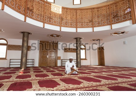 Black African Muslim Man Reading Holy Islamic Book Koran