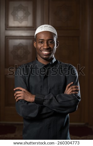 African Muslim Man Making Traditional Prayer To God While Wearing A Traditional Cap Dishdasha African Muslim Man Making Traditional Prayer To God While Wearing A Traditional Cap Dishdasha