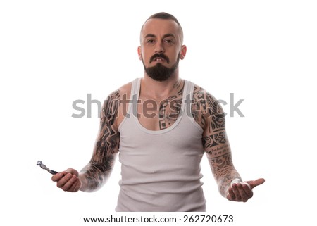 Tattooed Man Styling Beard Holding Disposable Razor - Isolated On White Background