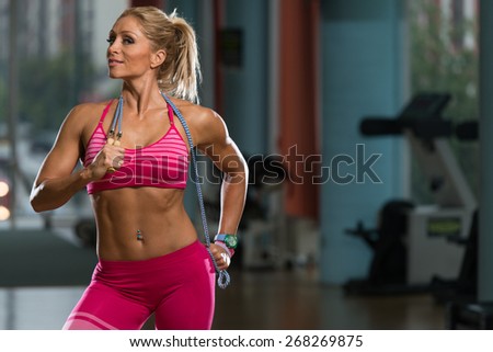 Middle Age Woman Playing Around With Jumping Rope As Part Of Bodybuilding Training
