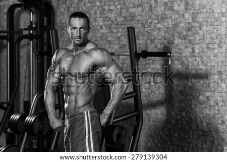 Portrait Of A Physically Fit Man In Modern Fitness Center - Black And White Photo