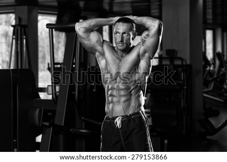Portrait Of A Physically Fit Man In Modern Fitness Center - Black And White Photo