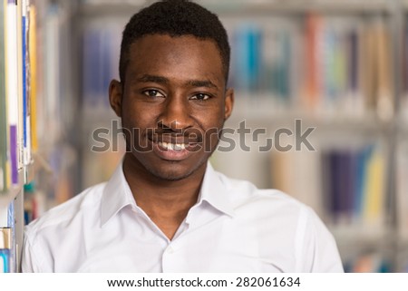 Portrait Of Clever Black Student In College Library - Shallow Depth Of Field