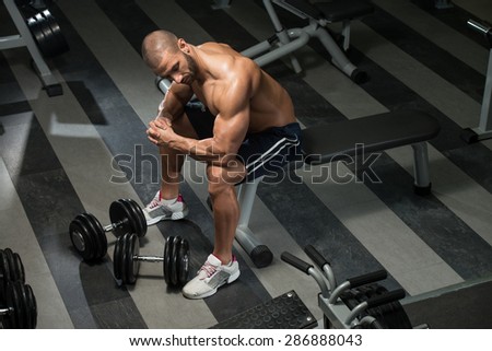 Portrait Of A Physically Fit Man Resting In A Health Club