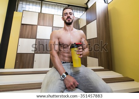 Handsome Muscular Man Drinking Protein Drink