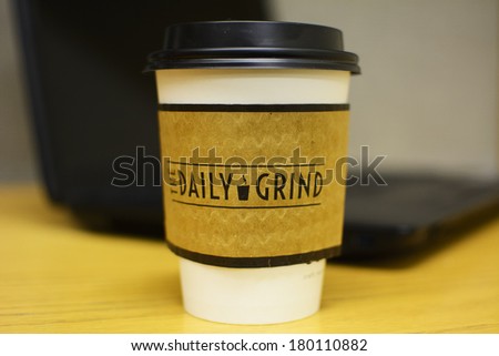 Edmonton, Canada, February 25, 2014: A small cup of coffee of The Daily Grind cafe, a student union run cafe at University of Alberta, Edmonton. The Daily Grind cafe uses organic fair trade coffee.