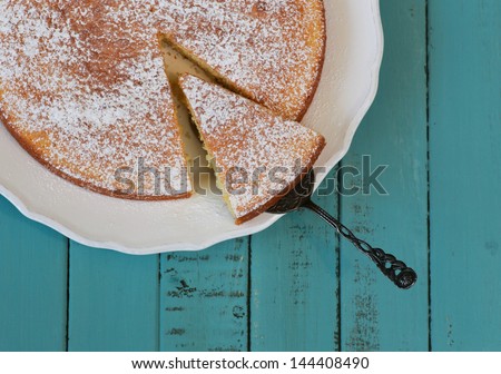 Lemon Cake On White Plate And Turquoise Table