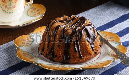 Mini Pound Cake - Hazelnut cake with chocolate drizzle with old pictures coffee cup and side plate