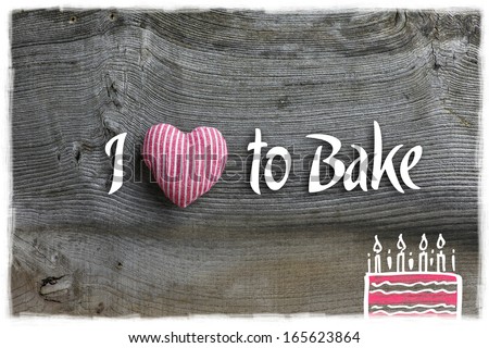 Love to bake message  handmade decoration red stripes fabric hearth over rustic Elm wood background - retro style design