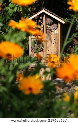 Wooden insect house decorative bug hotel, ladybird and bee home for butterfly hibernation and ecological gardening